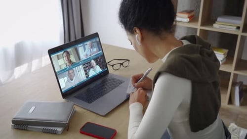 Young Woman Participating in Video Call at Home