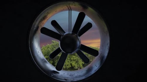Spinning Industrial Fan Blades Inside Circular Vent Pipe