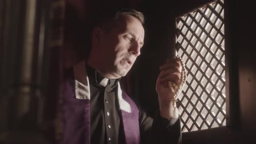 Priest Talking to Parishioner in Confession Booth