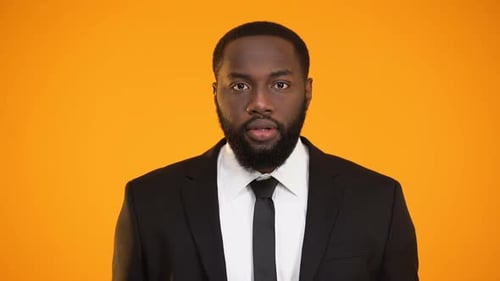 Excited Bearded Man Gesturing in a Suit