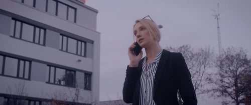 Blonde Woman Talking on Cell Phone Outdoors
