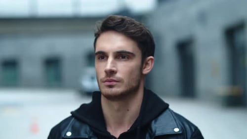 Handsome Young Adult in Leather Jacket Outdoors