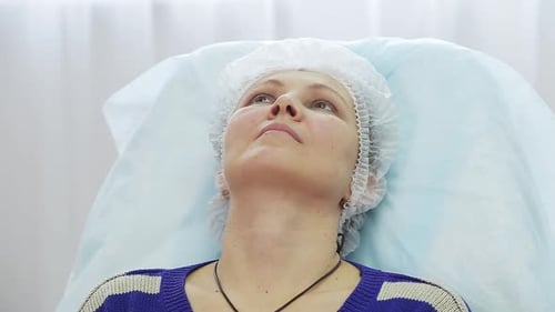 Woman Receives Facial Treatment at Spa