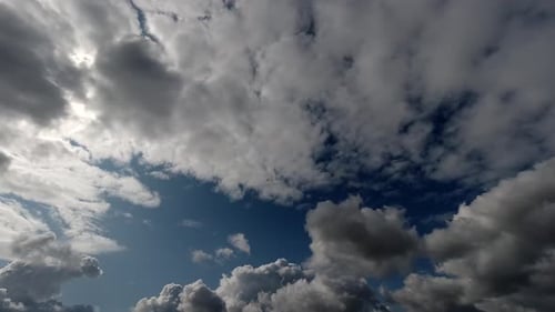 Clouds Moving Across the Blue Sky on Sunny Day