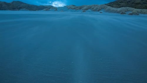 Dark Beach with Wind Blown Sand at Night