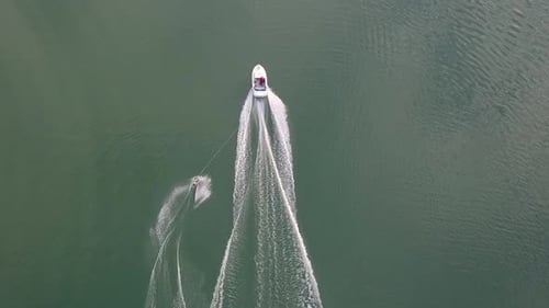 Aerial View of Water Skier Pulled by Boat