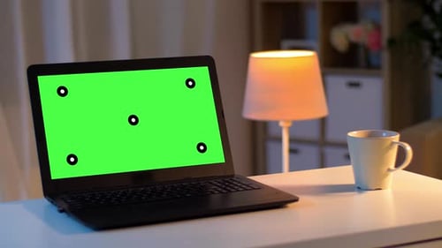Laptop with Chroma Key Green Screen on Table