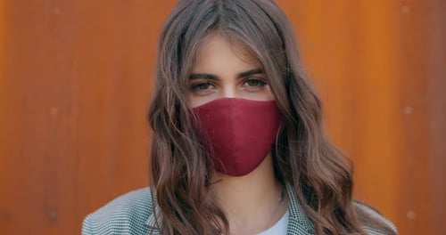 Close Up View of Young Pretty Brunette Girl Wearing Cotton Mask and Looking To Camera, Portrait
