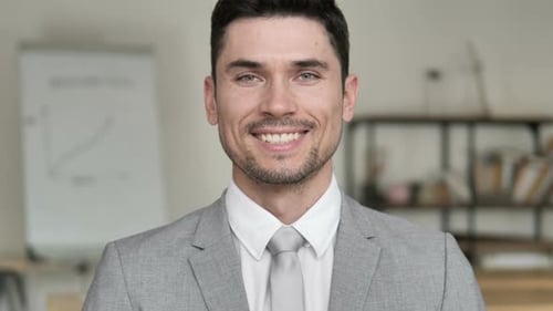 Smiling Young Adult Man in Workplace