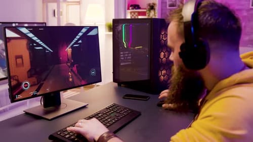 Man Plays First Person Shooter Video Game