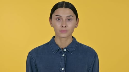 Woman Portrait Against Yellow Background