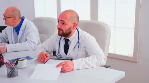 Doctor Talking About Healthcare During Seminar with Hospital Staff