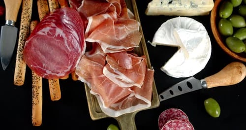 Antipasto with Pieces of Cheese Slowly Rotates.