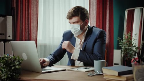 Tired Executive Senior CEO Businessman in Medical Mask Finishing Working Online on Laptop Remote