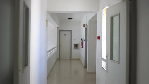 Clean, Bright Hallway with White Walls and Doors