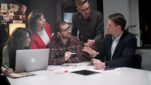 Team Collaborating on a Project at Table