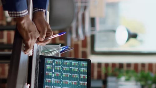 Vertical Video Banking Specialist Analyzing Stock Market Statistics Report