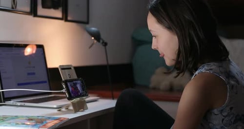 Teen Girl Having a Video Call at Night