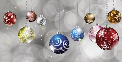 Sparkling Christmas Ornaments Decoration with Falling Snow and Bokeh Background