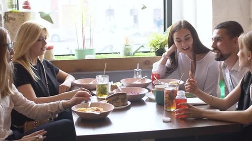 Friends Chatting at Lunch in Urban Cafe