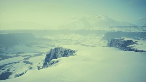 Snowcovered Rocks on a Windy Plateau