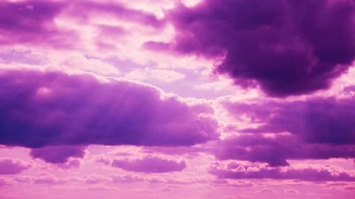 Pink and Purple Clouds Drifting in a colorful Sky