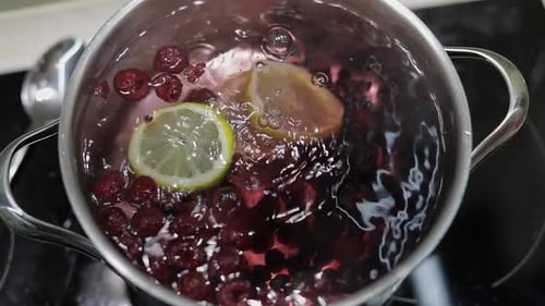 Boiling Berries and Lemon for Healthy Drink