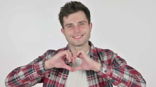 Man Making Heart Shape With Hands and Smiling
