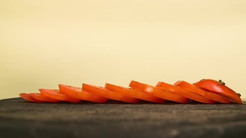 Shiny Red Tomato Sliced on Rustic Wood Surface
