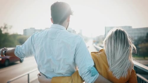 Romantic Young Couple in Love Hugging on the Street