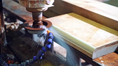Grinder cutting marble. Detail of a circular saw used to cut granite