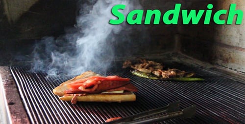 Chef Preparing Sandwich on Grill Indoors