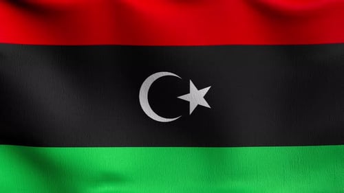 4K-VDO mit nahtlosem Loop. Die libysche Nationalflagge weht isoliert im Wind.