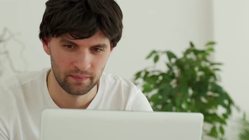 Businessman Using Laptop in Office Chatting in Social Network or Shopping Online Playing Game