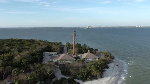 Picturesque Island Lighthouse and Beach Aerial View