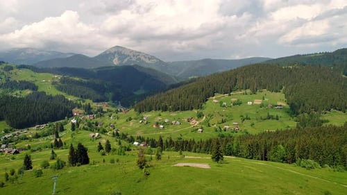 Mountain Village Under Cloudy Sky