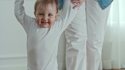 Baby's First Steps with Mother Indoors