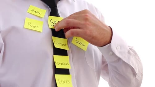 Seo Optimization, Notes On The Employees Tie And White Shirt. One Note Fell