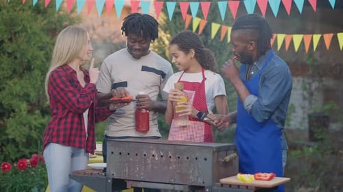 Friends and Family Enjoying Outdoor Barbecue Celebration