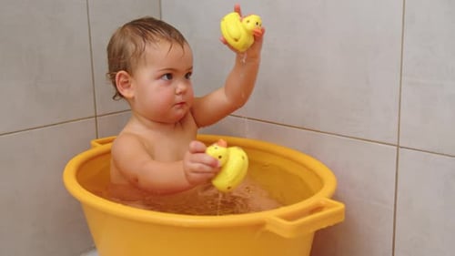 Baby Bath Time Playing with Rubber Ducks