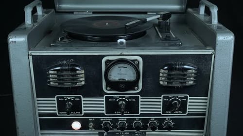 Antique Gray Turntable Plays Vinyl Record
