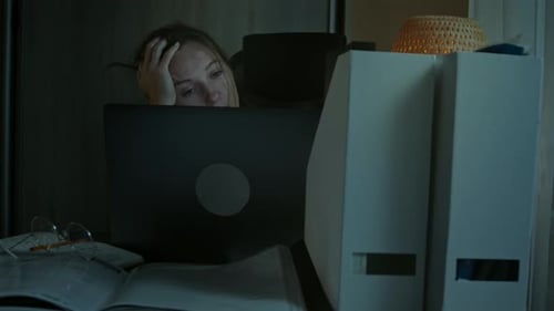 Woman Working At Home Late Night