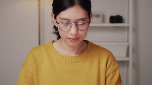 Woman Working on Laptop Indoors Close Up