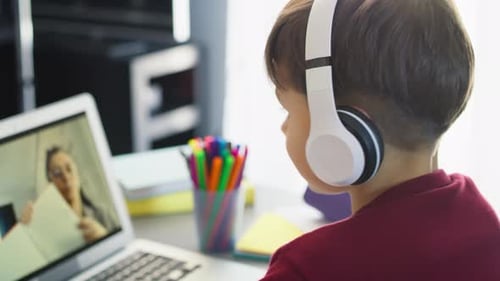 Child Learning Online with Laptop Computer and Headphones