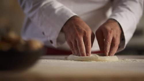 Pastry Cook Hands Knead Pizza Dough on Board