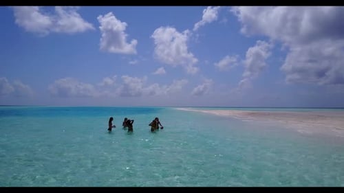 Tourists happy and smiling on perfect shore beach lifestyle by blue sea and white sand background of
