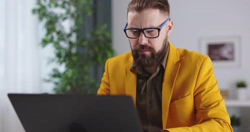 Man at Home with Laptop