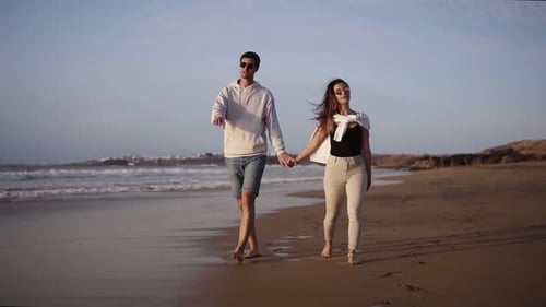 Caucasian Couple in Casual Clothes Resting Relax Holding Hand Walking Beach Honeymoon