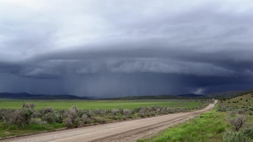 Time lapse of shelf cloud super cell storm moving over landscape