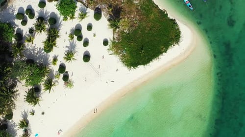 Beautiful sandy cape of tropical island with white exotic beach and palm trees surrounded by calm cl